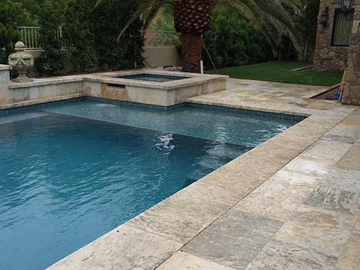 Antique Stone Pool Coping Slabs Milled at 2.5" in Thickness Installed in a pool and Jacuzzi in a Custom Home in Newport Beach